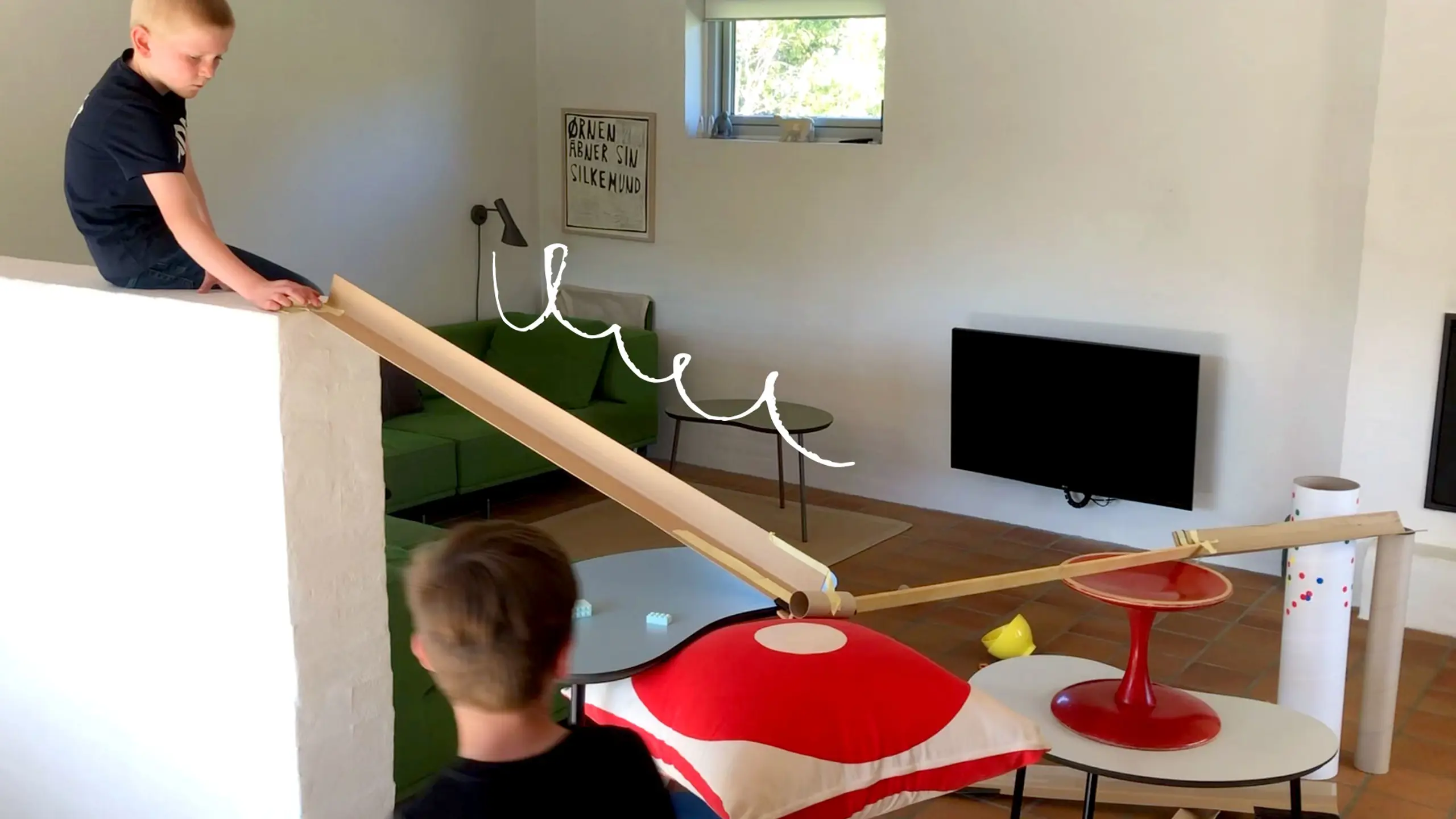 children building their maze in the house